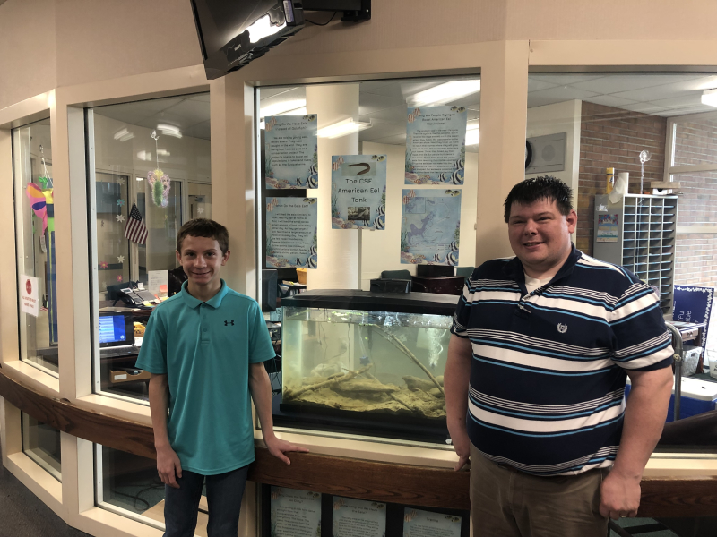 Abington Heights High School students with their eel aquarium.